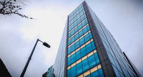 Low angle view of modern buildings against sky