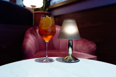 Close-up of wine glasses on table