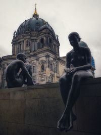 Statue of historic building against sky