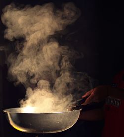 Close-up of person preparing food 