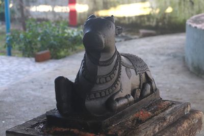 Close-up of statue against temple