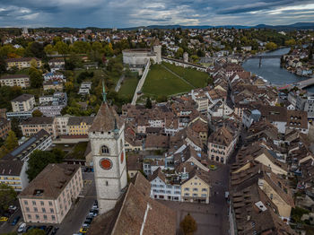 High angle view of town against cloudy sky