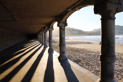 Shadow of colonnade on beach