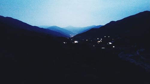Scenic view of silhouette mountains against sky