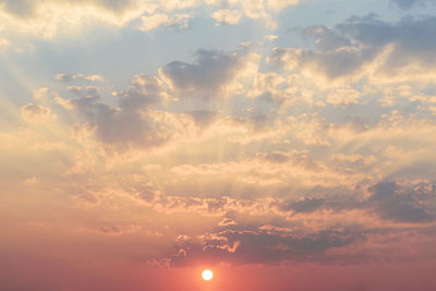 Low angle view of dramatic sky during sunset