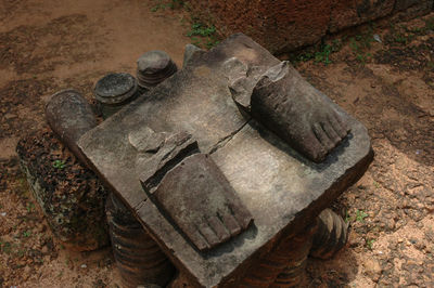 High angle view of old sculpture on field