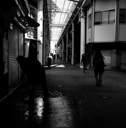 Men walking in corridor