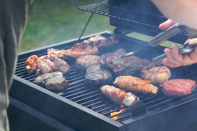 High angle view of meat on barbecue grill