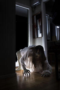 Spooky female ghost crawling in house