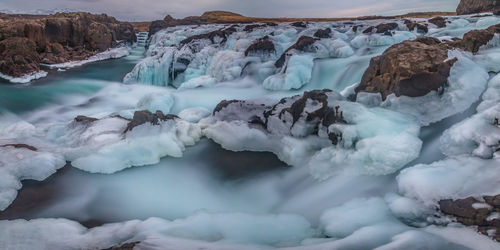 Panoramic view of natural ice sculptures of a frozen waterfall