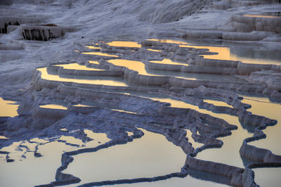 Idyllic view of travertine pools during sunset