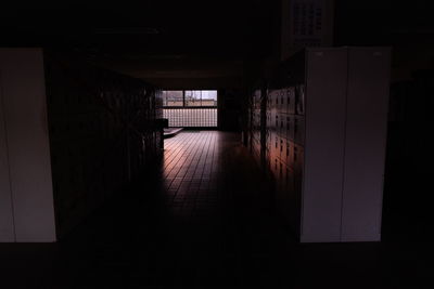 Empty road along built structures