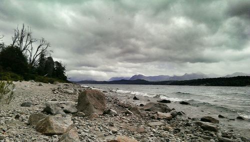 Scenic view of sea against cloudy sky