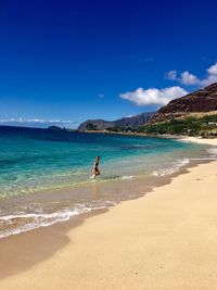 Man on beach against sky