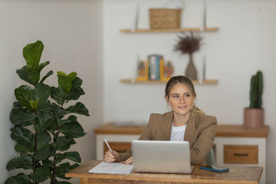 Woman working at home with laptop. home office.  notebook for working. 