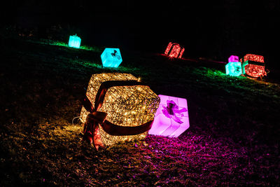 Illuminated lighting equipment on field at night