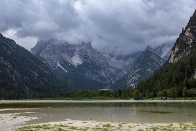 Scenic view of lake and mountains against sky