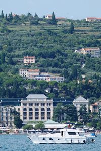 Scenic view of river by buildings in city