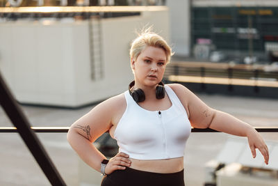 Portrait of young woman standing outdoors