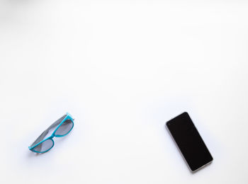 High angle view of eyeglasses on white background