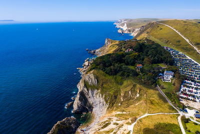 High angle view of beach by sea against sky