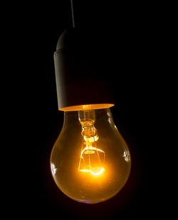 Close-up of illuminated light bulb