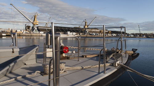 Boats moored on sea against sky