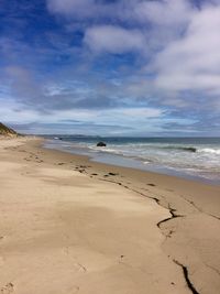 Scenic view of beach against sky