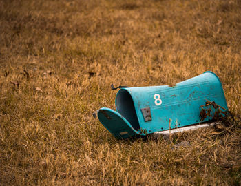 High angle view of suitcase on grassy field