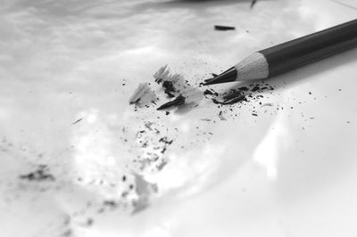 Close-up of pencil with shavings on table