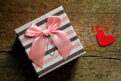 Close-up of gift on wooden table