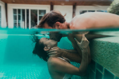 Couple swimming in pool