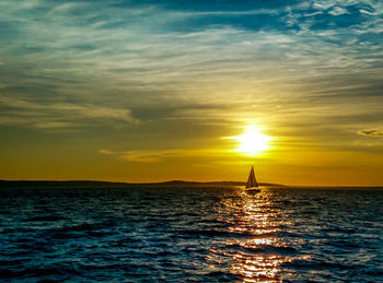 Scenic view of sea at sunset