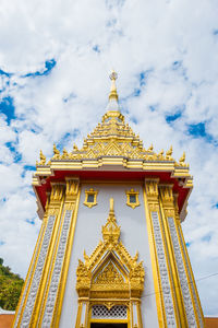 Low angle view of temple building against cloudy sky