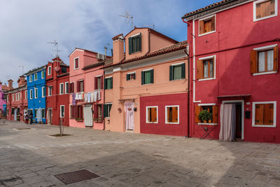 Houses in city against sky