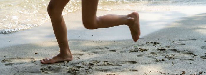 Low section of person on beach