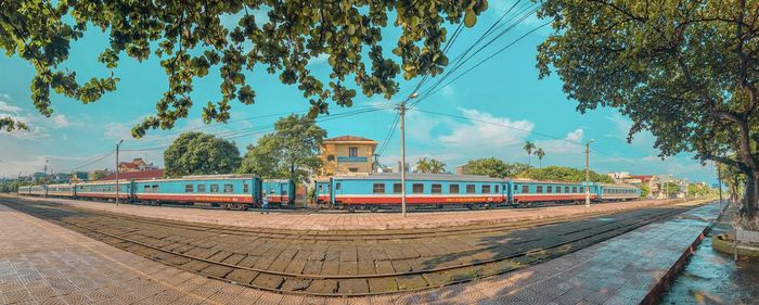 Train on railroad tracks against sky