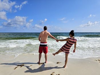 Young married couple on florida beach having fun.