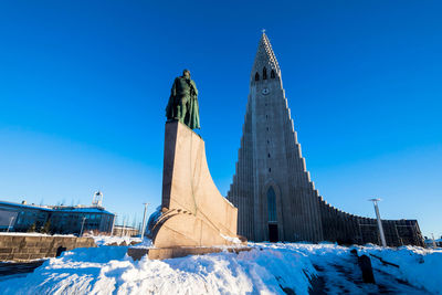 Low angle view of building against blue sky