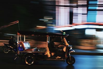 Blurred motion of vehicles on road in city at night