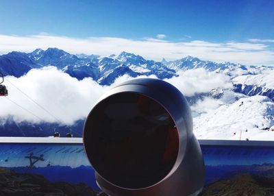 Scenic view of snow covered mountains against sky