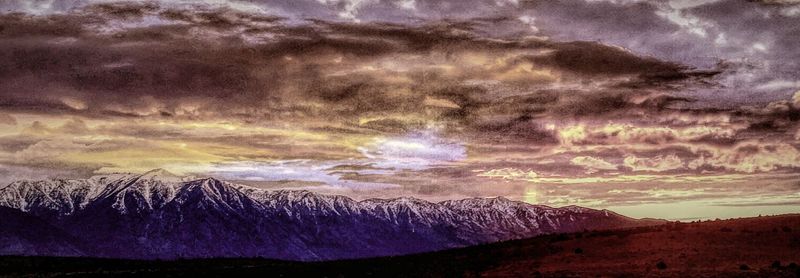 Scenic view of landscape against cloudy sky