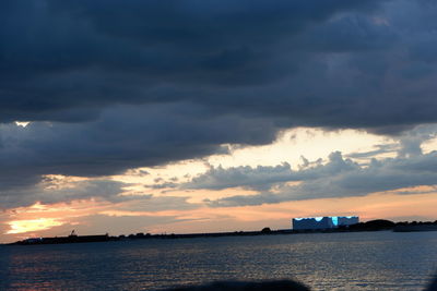 Scenic view of sea against dramatic sky