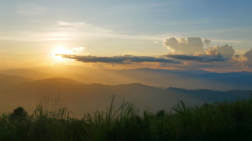 Scenic view of mountains against sky during sunset
