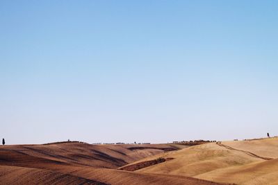 View of landscape against clear blue sky