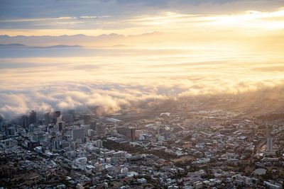 High angle view of buildings against sky during sunset