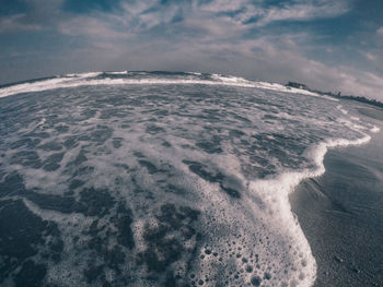 Scenic view of beach against sky