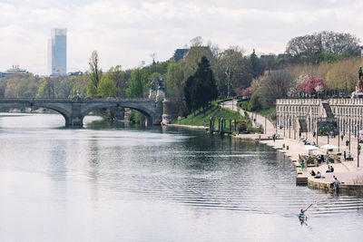 Beautiful aerial view of po river in torino, italy with buildings, skyscraper bridge and murazzi