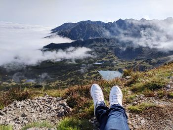 Low section of man against mountains