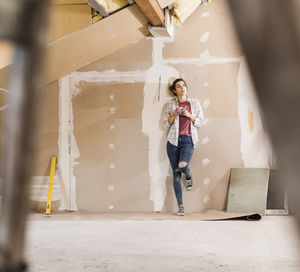 Young woman contemplating the renovation of her new home